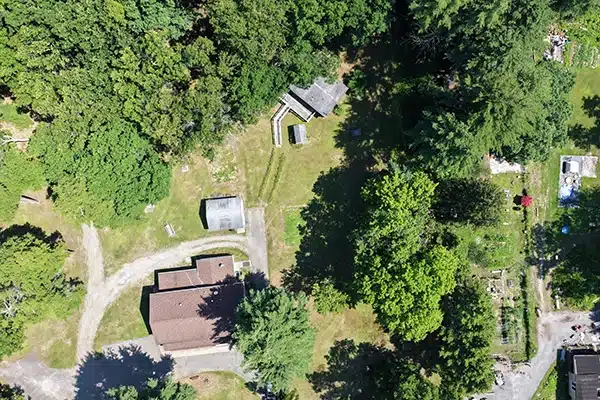 Single drone photo at maximum legal altitude showing only the building at 182 US-209
