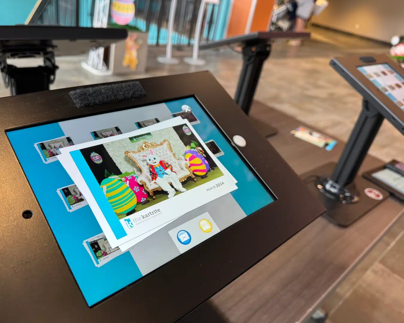 The self-serve booth kiosk at The Kartrite Resort & Indoor Waterpark during the Easter Bunny photo fundraiser — a print visible on the screen